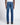 Rear view of a person wearing 7 For All Mankind Slimmy Jeans, Signal Blue with a white top and black shoes, standing against a light gray studio background.