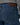 Close-up back view of a person wearing Brax Cadiz Straight Fit Jeans, Blue Used with a brown leather brand patch at the waistband and a gray top.