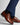BCarl Gross Ulf Leather Derby, Brown worn with navy pants on a light gray background