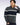 A man wearing a Eden Park khaki half zip sweater with white horizontal stripes, posed against a light studio background.