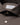 Close-up of a Eton Filo di Scozia Jersey Slim Fit Brown Shirt collar with a white neck label reading ETON and white buttons.