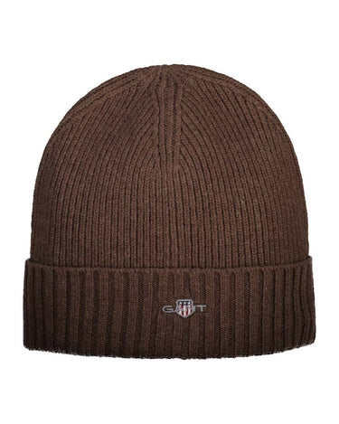 A GANT Shield Wool Beanie in Brown with a folded cuff, featuring a small embroidered G-1000 logo on the front, set against a plain white background.
