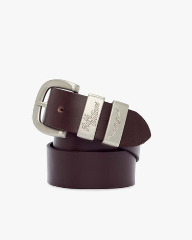 A brown leather belt with a metallic buckle, the brand 'R. M. Williams' is visible on the buckle.