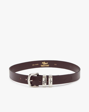 A R.M. Williams Slim Drover Belt, Chestnut with a polished silver-tone buckle and keeper, displayed on a clean white background. The inside of the belt shows the brand name 'Missoni' and size markings.