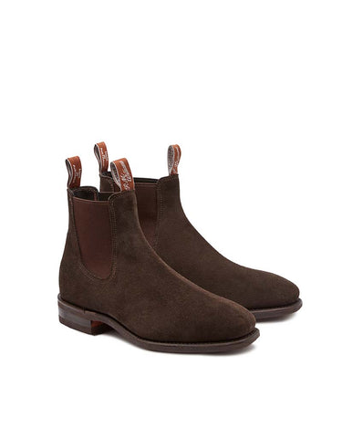 A pair of R.M. Williams Suede Craftsman Boot, Chocolate with elastic side panels and pull tabs, shown on a clean white background.