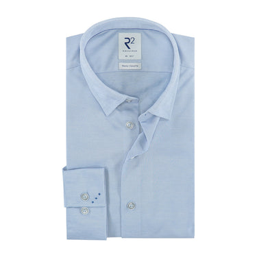 AR2 Modern Fit Travel Shirt, Light Bluewith a collar and buttons down the front, branded with 'R2' on the cuff.