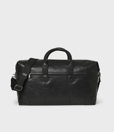 A Saddler Metz Leather Weekend Bag, Black made of leather, featuring a shoulder strap and a front zipper.