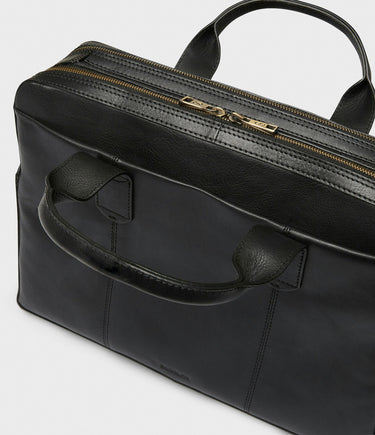 Saddler Noret Leather Laptop Bag, Black with gold zipper on a white background