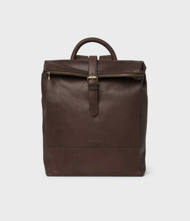 A Saddler Palermo Leather Backpack, Dark Brown with a front zipper pocket and adjustable straps.