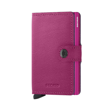A pink Secrid miniwallet with a crispy texture and metallic clasp.