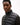 Man wearing aTommy Hilfiger Intechno Zip Jacket, Black with a brand logo on a white background