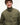 A smiling man wearing an olive green Tommy Hilfiger Corduroy Collar Padded Ripstop Barn Jacketwith dark buttons, photographed against a clean white studio background.