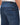 The image captures the back view of a pair of 7 For All Mankind Paxtyn Tapered, Mid Blue jeans. The jeans are presented in a faded style, emphasizing their casual and versatile appeal.