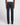 Rear view of a person wearing 7 For All Mankind Sateen Trousers, Navy, a white t-shirt, and black shoes against a light gray studio background.