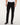 A person 7 For All Mankind Slimmy Jeans, Black with a white shirt and black leather boots, shown from the waist down against a plain light background.