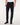 A person wearing7 For All Mankind Slimmy Jeans, Blue Black with a white t-shirt and black leather boots, shown from the waist down against a plain white studio background.