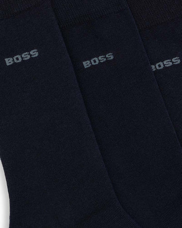 Three navy blue crew socks with the BOSS logo printed in light gray, arranged diagonally.