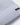 Close-up of aBOSS Fati Virgin Wool Beanie, Open Blue with a small black rectangular brand tag on the cuff.