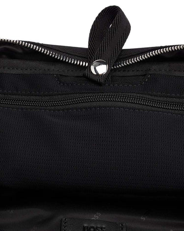 Close-up of a BOSS Highway Logo Washbag, Black with a top carrying loop and silver-tone metal hardware, showing a small BOSS logo patch near the bottom.