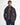 Man wearing a Barbour Ogston Waxed Jacket in Rustic Brown with a quilted design on a white background