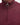 Close-up of a Barbour Tisbury Half Zip Jumper in Ruby color, showing the silver-tone zipper pull ring and the tonal Barbour logo on the chest.