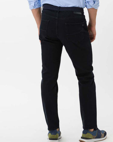 Person wearing Brax Cadiz Straight Fit Jeans, Dark Blue on a white background