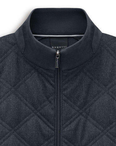 Close-up of a Bugatti Hybrid Jacket in Navy with a ribbed mock neck collar, featuring a silver zipper and a visible 'bugatti' brand label inside the collar.