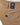Close-up of Club of Comfort Denver Chino, Beige showing the back pocket with a black button and a navy blue Club+Comfort brand label.