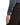 Close-up of a person wearing a Eton Filo di Scozia Jersey Slim Fit Shirt with a buttoned cuff and black trousers against a white background.