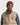 Person wearing a beige puffer vest with a brand logo and a GANT Shield Wool Beanie in Plumped Red on a white background