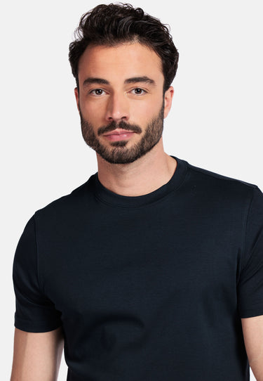 Man wearing a Giordano Luca Liquid Cotton Tee, Navy against a plain background