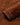 Close-up of a Hackett Suede Four Pocket Jacket, Nut Brown showing the fabric texture, buttoned cuffs, and dark buttons.