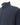 Close-up of a Paul & Shark Typhoon Hybrid Zip Jacket, Blue with a stand collar and a contrasting dark sleeve, shown against a plain off-white background.