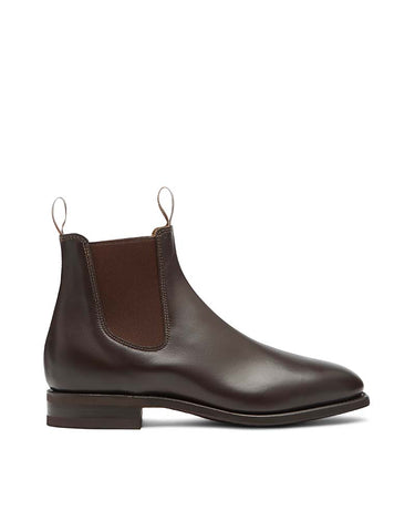 A R.M. Williams Craftsman Wide Fit, Chestnut boot with a matching dark brown elastic side panel and pull tabs, shown in a side profile on a light gray background.