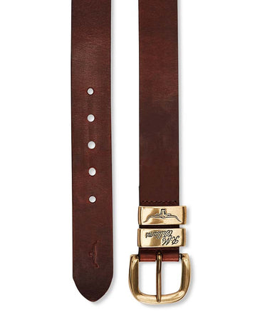 A R.M. Williams Drover Belt, Mid Brown with a polished gold-tone buckle and a matching gold-tone keeper, displayed vertically on a white background.