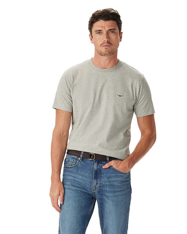 A man wearing a R.M. Williams Parson T-Shirt, Grey Marle with a small embroidered logo on the left chest, paired with blue jeans and a brown belt, against a plain white background.