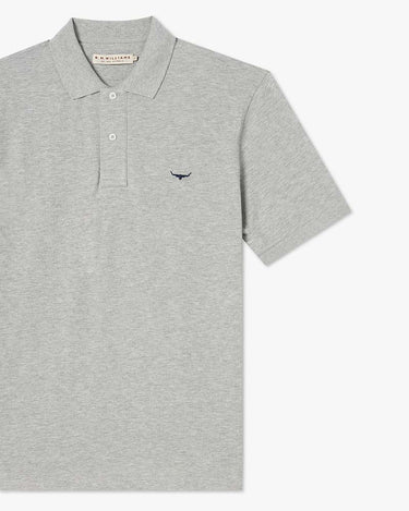 A R.M. Williams Rod Pique Polo, Greywith a small navy embroidered bird logo on the left chest, displayed on a clean white background.