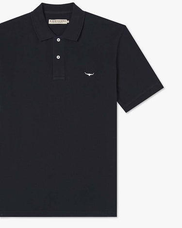 R.M. Williams Rod Pique Polo, Navy, featuring a small white embroidered bull logo on the left chest, displayed on a clean white background.