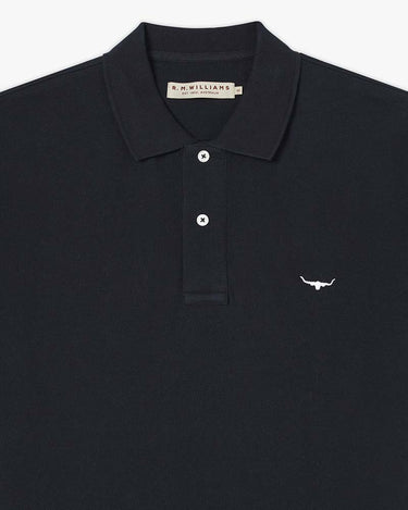 A close-up of a navy polo shirt by R.M.
