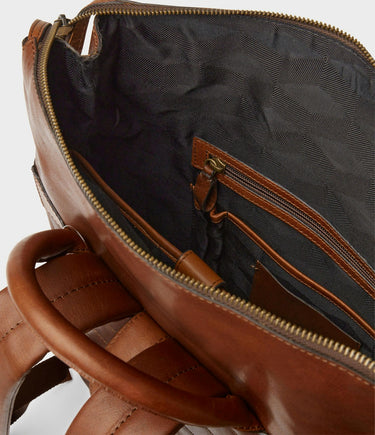 Brown leather bag with open zipper showing black interior
