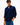 A man wearing a Tommy Hilfiger Fine Corduroy Shirt in Navy with rolled-up sleeves and blue jeans, standing against a plain white studio background.
