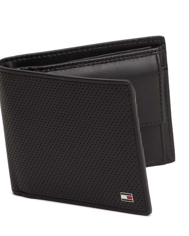 A Tommy Hilfiger Leather Coin Wallet, Black with a perforated leather front panel and a small Tommy Hilfiger flag logo on the bottom right corner, shown on a white background.