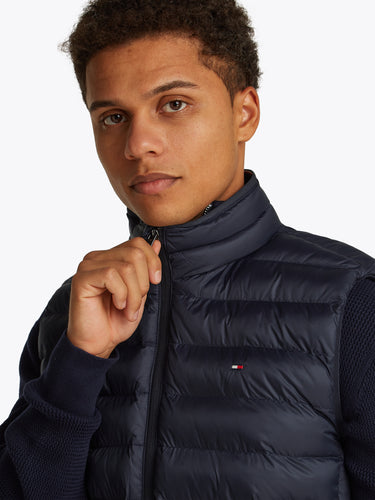 Man wearing a Tommy Hilfiger Packable Quilted Gilet, Navywith a visible brand logo on a white background