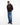 A man wearing a Tommy Hilfiger Peached Fleece Contrast Drawstring Hoodie with white drawstrings, blue jeans, and brown leather shoes, standing against a plain white studio background.