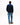 A man viewed from behind wearing a Tommy Hilfiger Quarter Zip Jumper in Navy, blue jeans, and black leather shoes, standing against a plain white studio background.